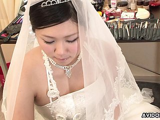 Brunette Emi Koizumi fucked on the top of wedding dress uncensored.